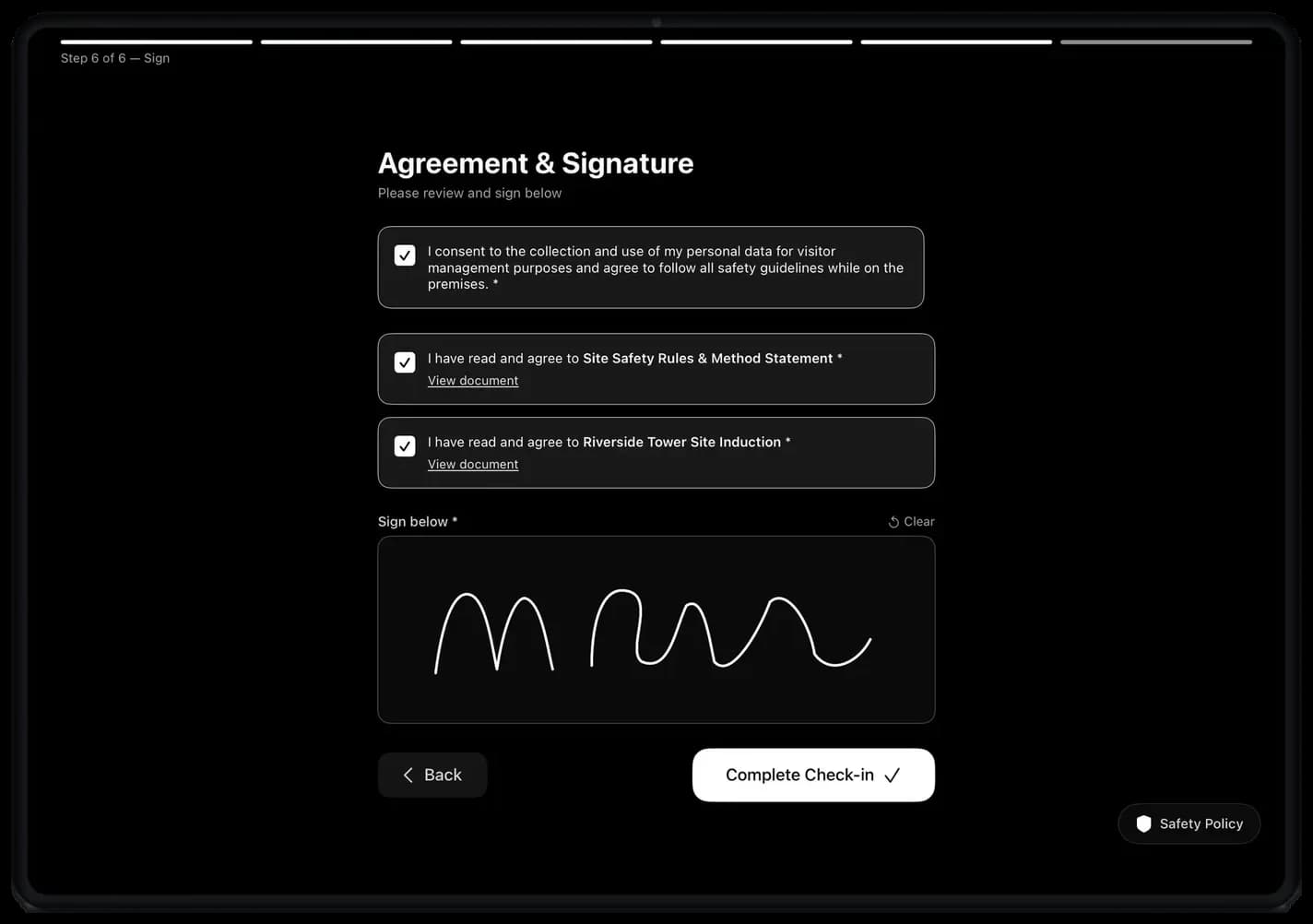Kiosk agreement step with consent checkboxes and a signature pad
