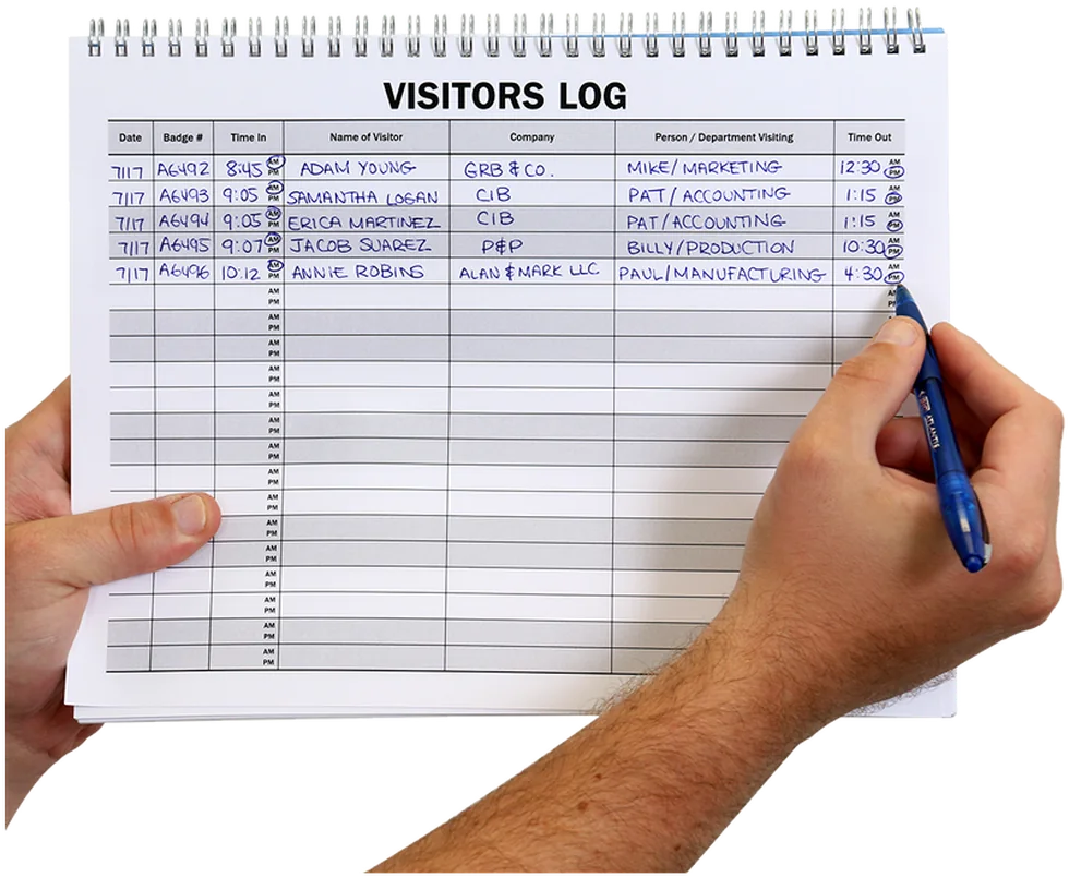 A paper visitors log book being filled in by hand with date, badge number, time in, visitor name, company and time out
